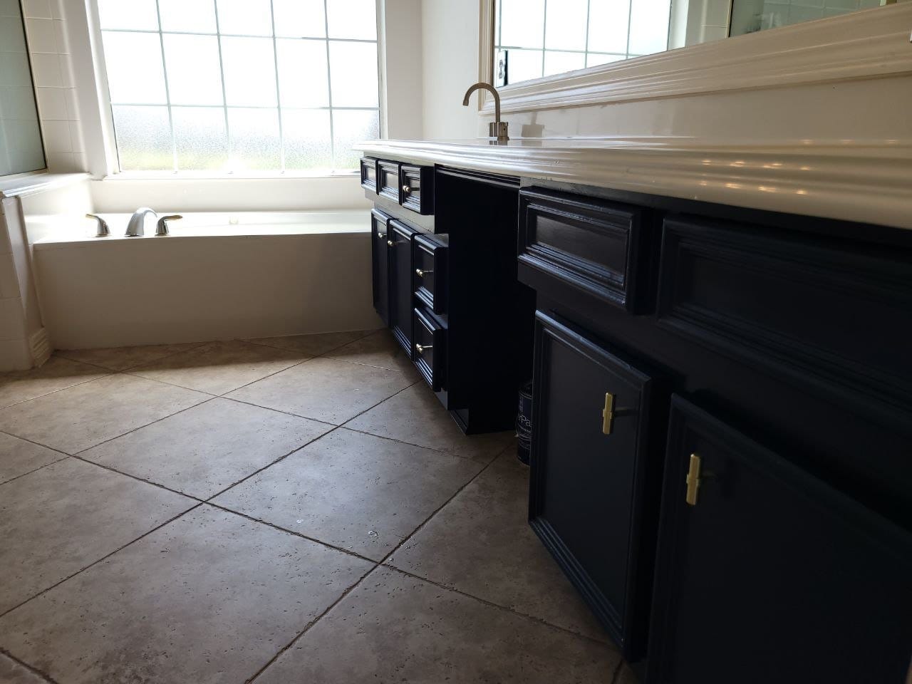 Navy blue kitchen island cabinets painted by The Proud Paintbrush in Fort Bend County