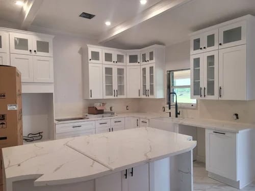 White shaker kitchen cabinets refinished with a sprayed enamel in Sugar Land, TX