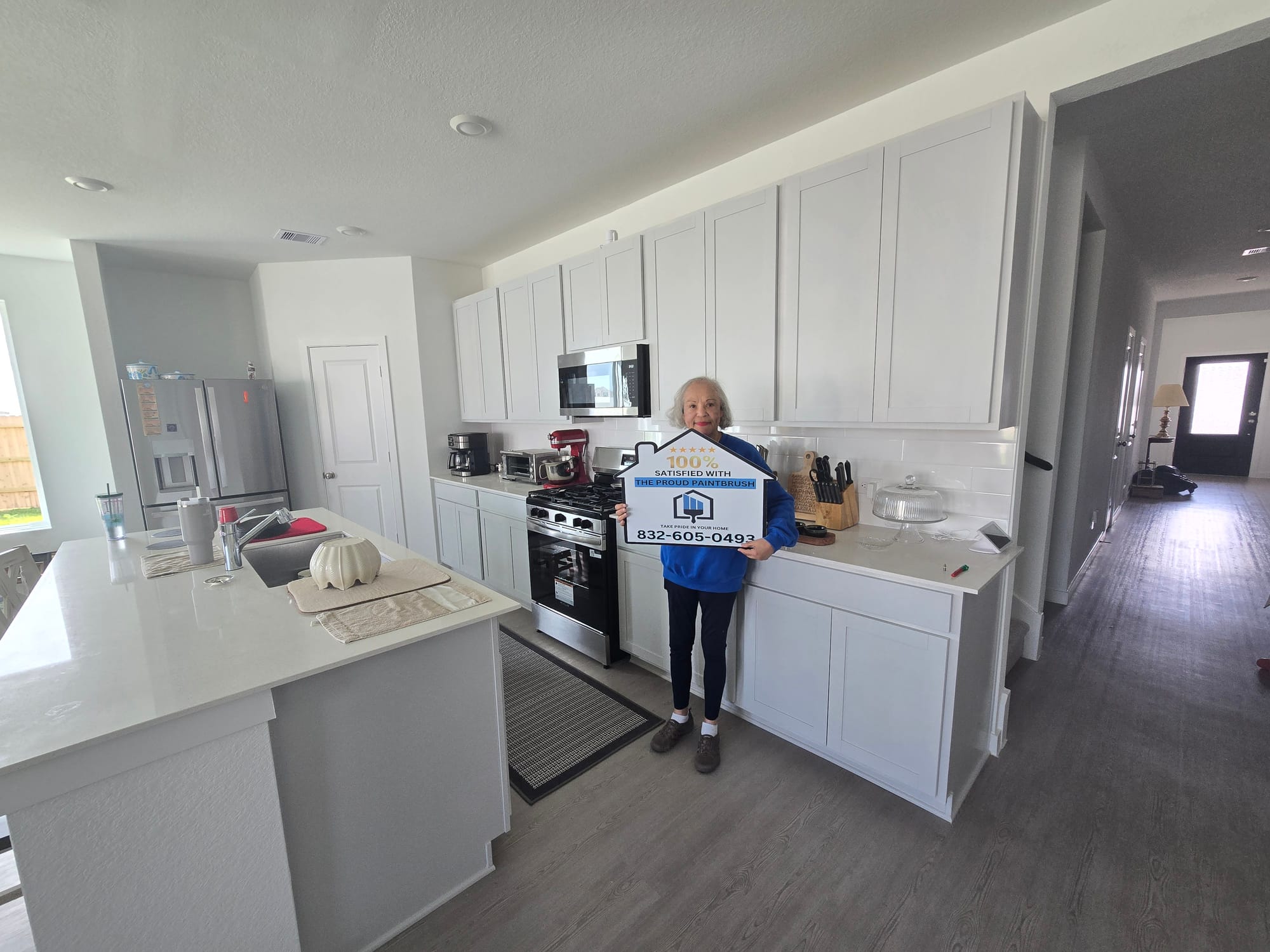 Freshly painted white kitchen cabinets in a Sugar Land, TX home by The Proud Paintbrush