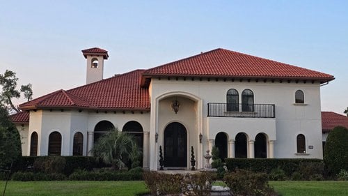 Spanish-style exterior house painting in Richmond, TX