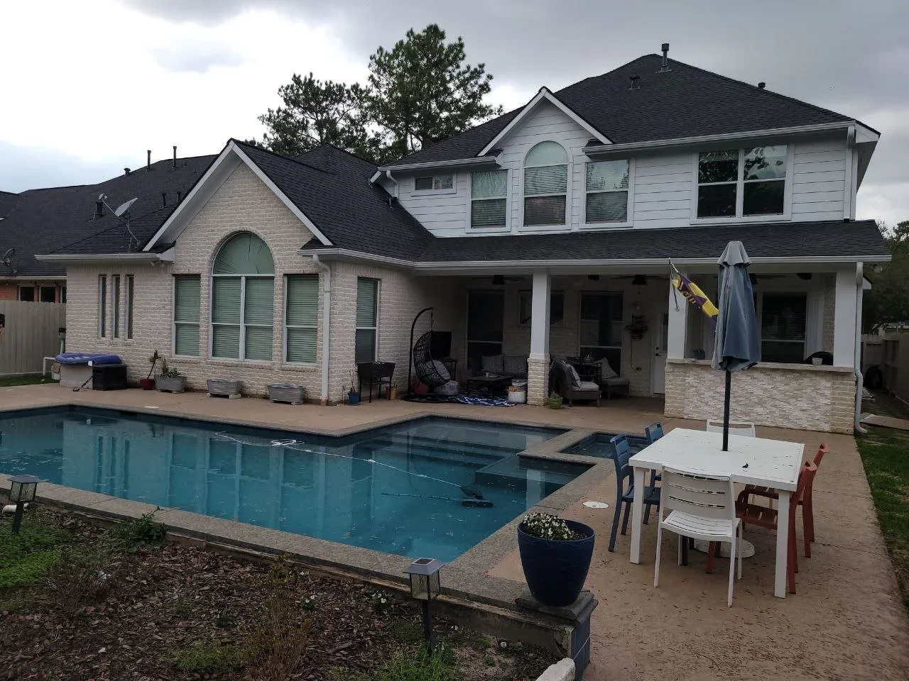 Backyard Pool Home Exterior in Richmond, TX by The Proud Paintbrush