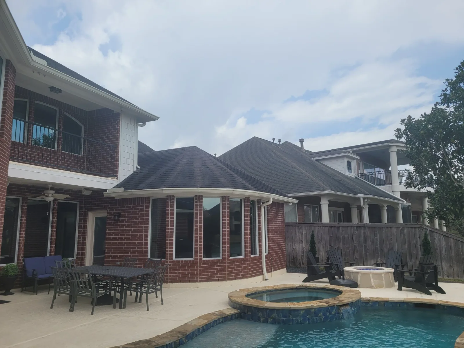 Brick Home Backyard Pool Patio in West Houston, TX by The Proud Paintbrush