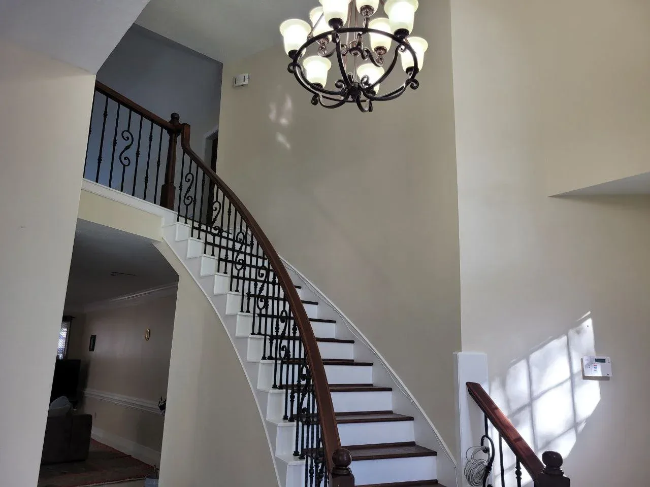 Curved Staircase Foyer Repaint in Southwest Houston, TX by The Proud Paintbrush
