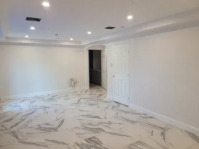 Freshly painted bedroom with cool off-white walls and no furniture in Katy, Texas