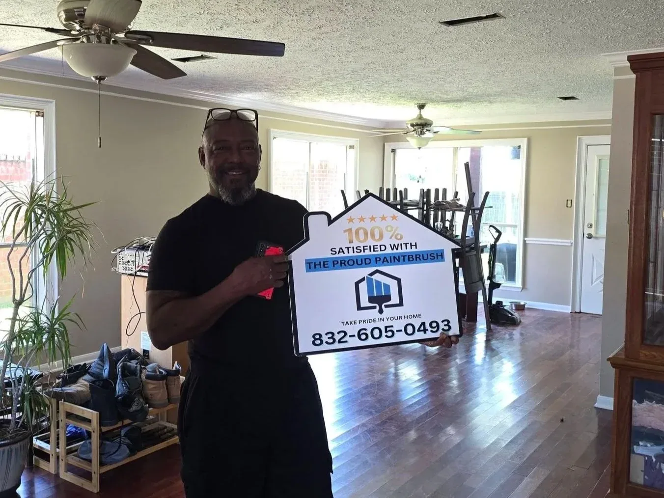 Satisfied customer in a freshly painted kitchen in Fulshear, Texas