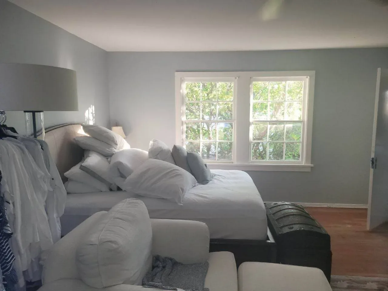 Soft neutral bedroom with calming wall colors in Katy, TX by The Proud Paintbrush