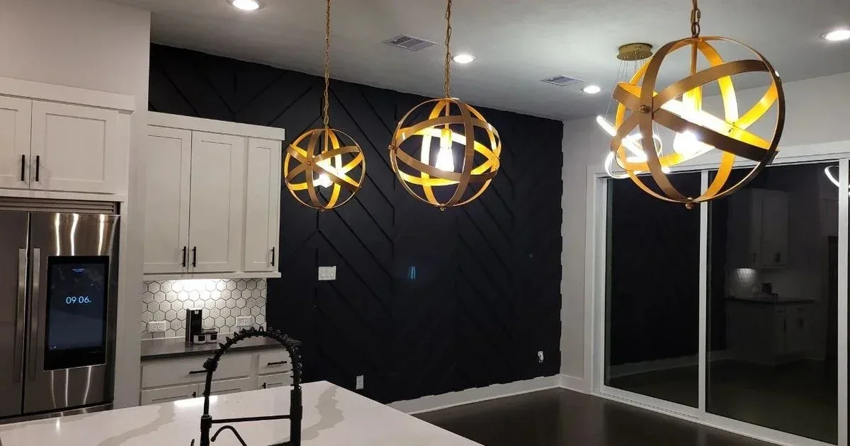 Freshly painted kitchen with a bold black feature wall in a Katy, Texas home
