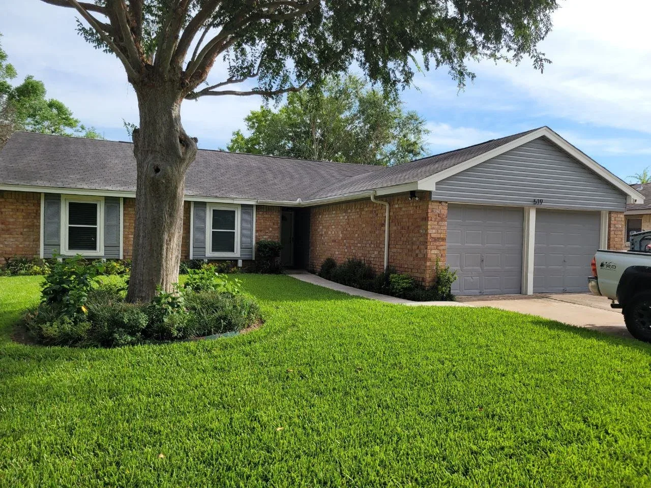 Small house freshly painted blue with white trim in Sugar Land, Texas