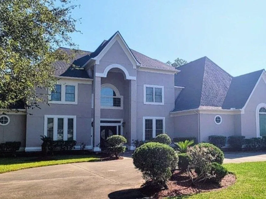 Tan Stucco Luxury Home Exterior Repaint in West Houston, TX by The Proud Paintbrush