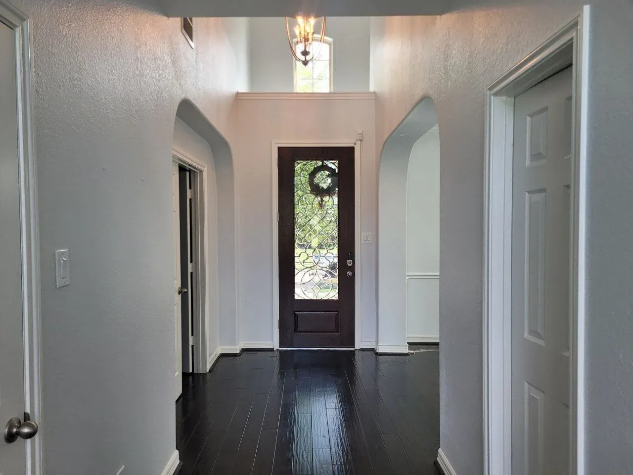 Two-story hallway in a cool off-white in Richmond, TX