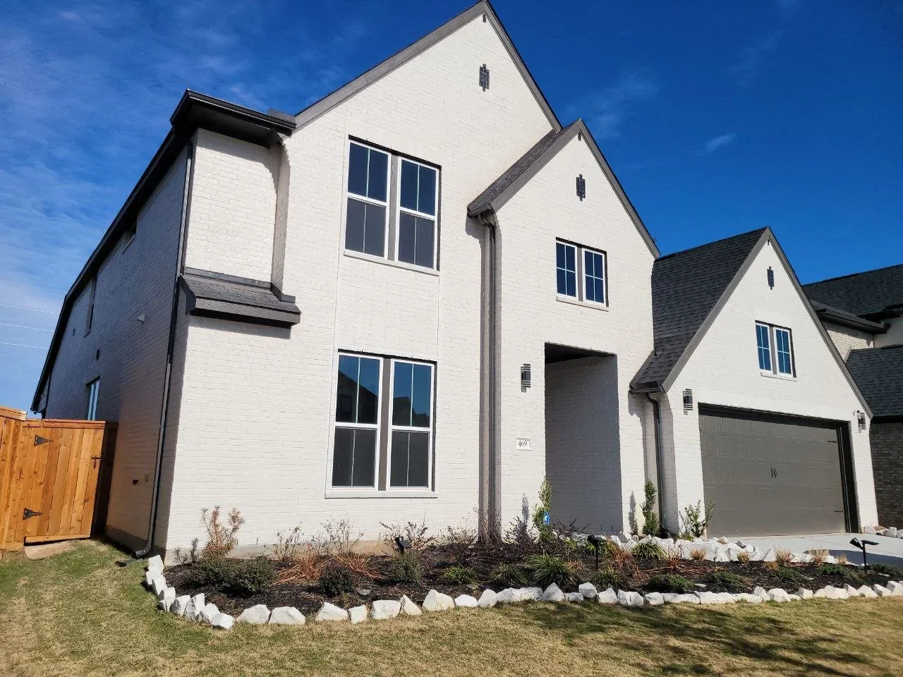 White Brick Two Story Exterior in Katy, TX by The Proud Paintbrush