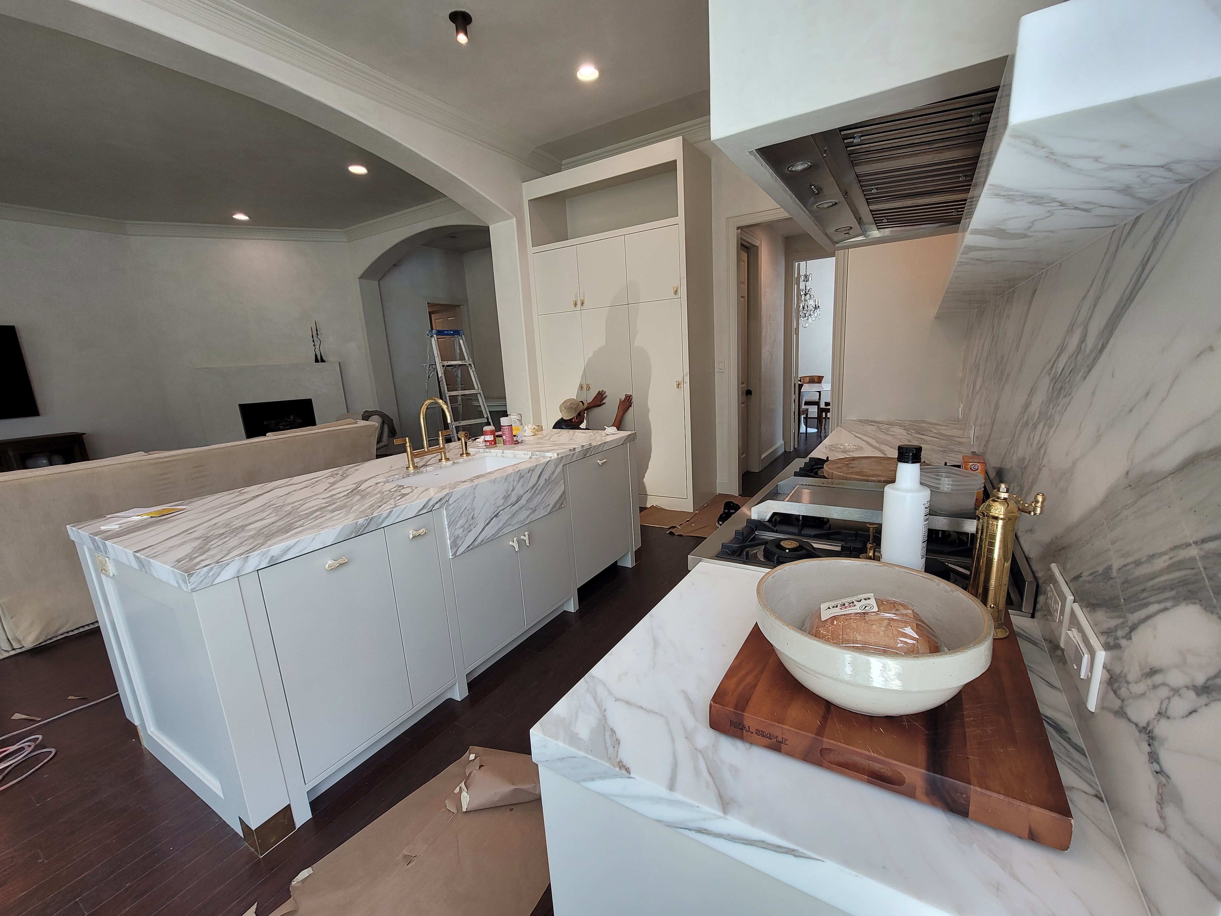 White Kitchen Cabinet Repaint Marble in Richmond, TX by The Proud Paintbrush