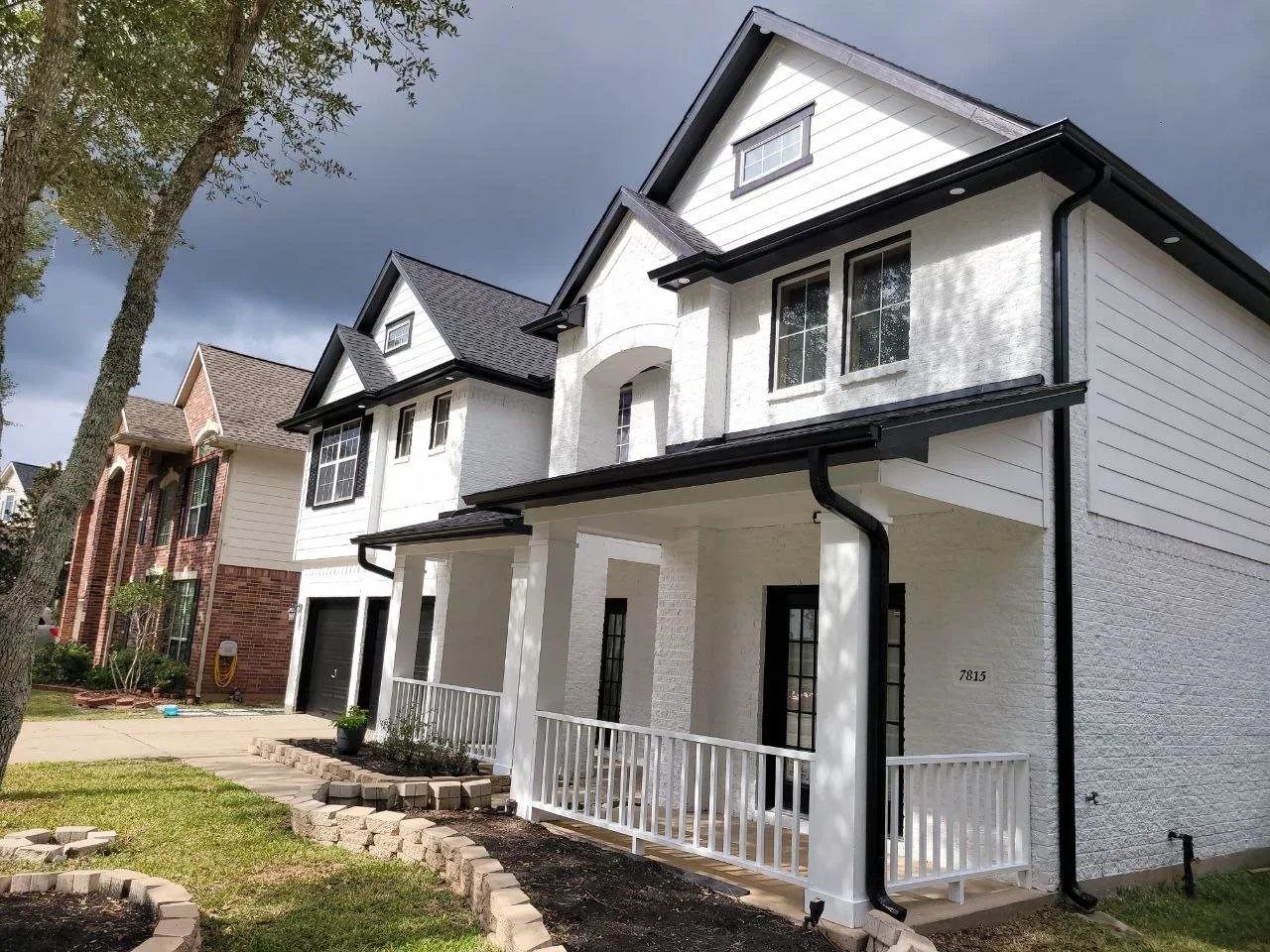 White Modern Farmhouse Exterior in Sugar Land, TX by The Proud Paintbrush