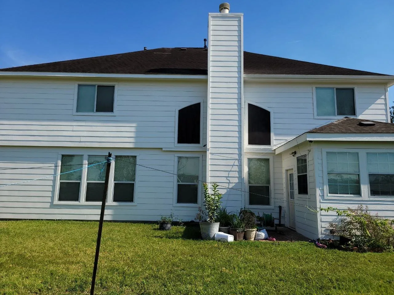 White Siding Exterior Repaint in Fulshear, TX by The Proud Paintbrush